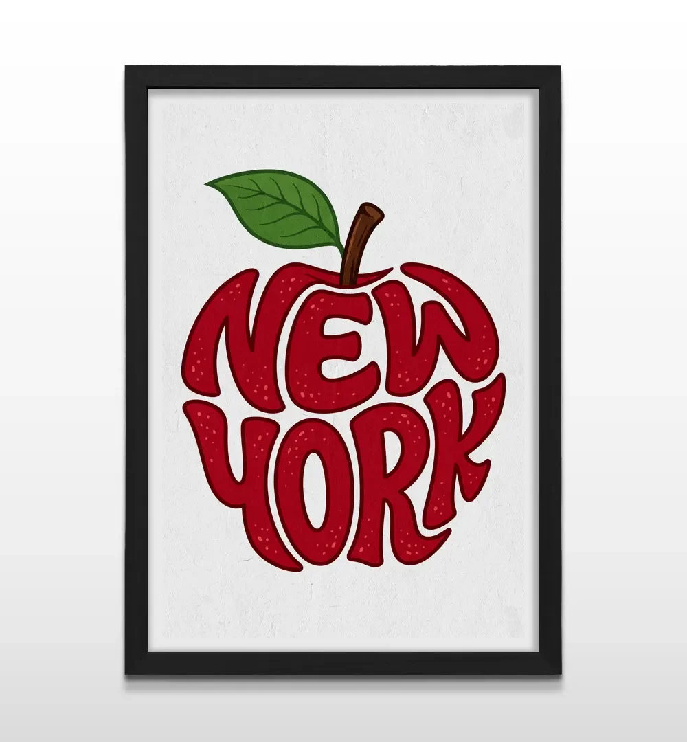Cuadro vertical en marco negro con lámina gráfica de una manzana roja con la tipografía manuscrita NEW YORK